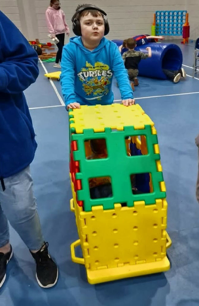 Boy playing at Autism Eileanan Siar fun session - autism support group in Western Isles