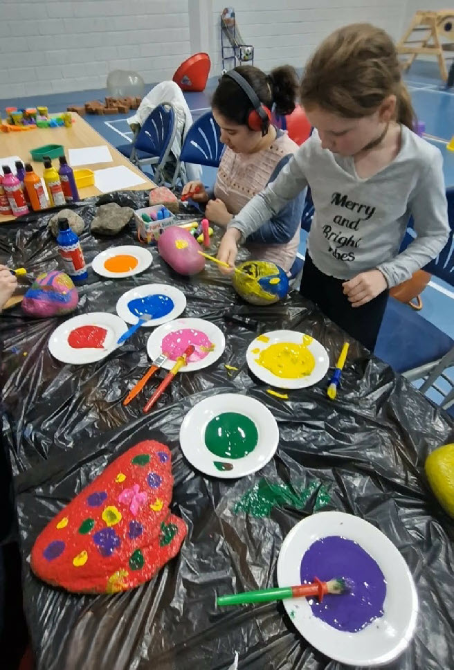 Children painting at Autism Eileanan Siar fun session - autism support group in Western Isles