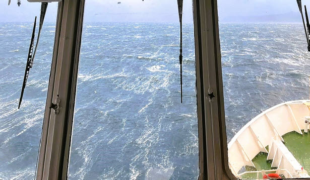 Ship navigating through rough seas 